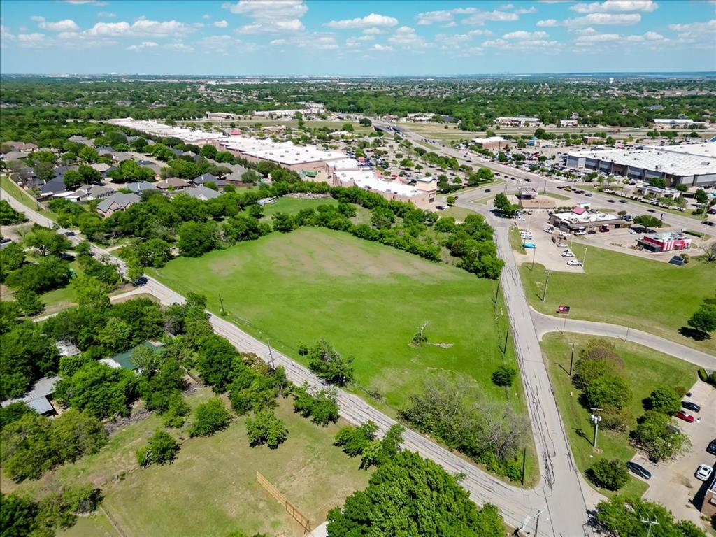 Prime hard-corner commercial development opportunity in the high-growth Mansfield market. This plus or minus 3-acre tract offers exceptional frontage, visibility, and ingress & egress, strategically positioned directly across from QuikTrip and in close proximity to major anchors including Sam’s Club and Lowe’s. The site is surrounded by a strong mix of national retailers, dining, and continued commercial and residential expansion, supporting a wide range of retail, service, or investment uses. Zoned C-2, the property allows for flexible development configurations. Utilities include city water available at the street, with sanitary sewer nearby. The tract is bisected by a Tarrant Water District easement, creating a natural subdivision opportunity, and ownership is open to subdividing to accommodate user or investor needs.