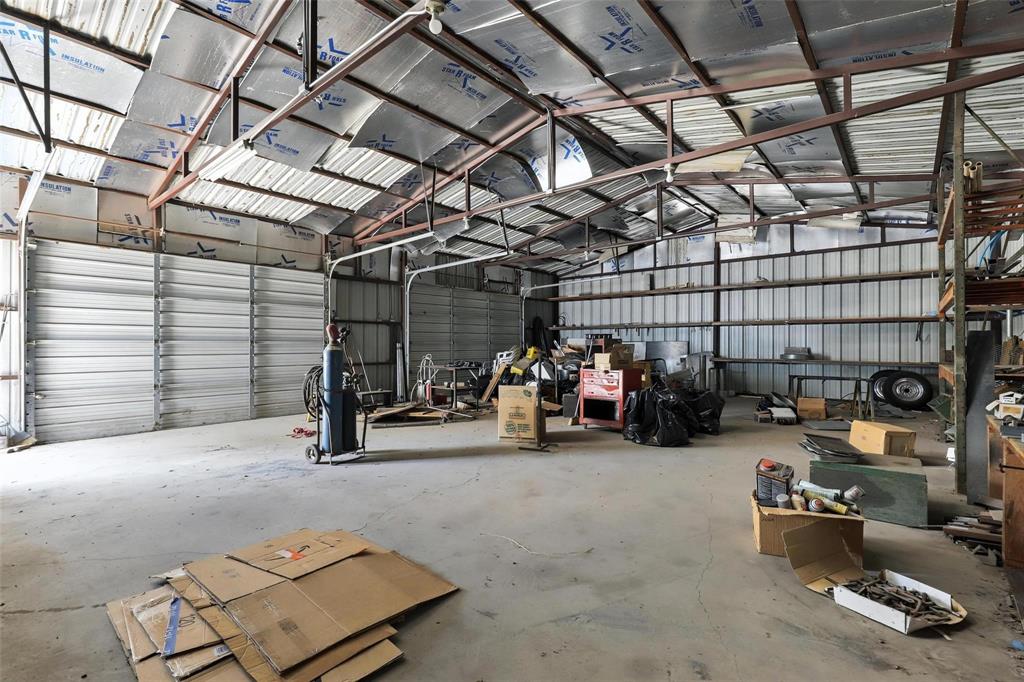 Fantastic Opportunity For Business Use Or Residential Conversion! Versatile Commercial-Style Unit Located In A Residential Area Offering Endless Potential For A Mechanic Shop, Workshop, Rental Income, Or Future Home Conversion. Features Approximately 1,200 Sq Ft, Two Bays With Roll-Up Doors, And Existing Electric Meter Already In Place. Located Outside City Limits With Quick Access To Major Highways For An Easy Commute. Great Opportunity For Investors, Business Owners, Or Those Looking For Flexible Use Space.