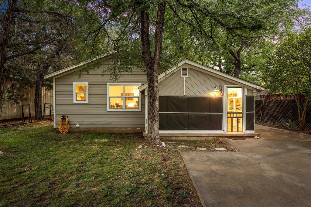 Welcome to Loma Verde Lakehouse, a short term rental just a 5 minute walk to Lake Whitney. This cozy 2 bedroom, 1 bath retreat is the perfect place to slow down, unplug, and enjoy the quiet of lake living. Tucked beneath mature trees, the setting is peaceful and private, with just the right amount of shade and natural beauty. Inside, the home offers a comfortable and welcoming layout with a spacious living area, dining space, and light filled kitchen. The screened in porch is an extension of the living space, perfect for coffee in the morning or relaxing after a day at the lake. The large deck and shaded backyard create even more space to unwind, entertain, or simply enjoy being outside. In just minutes, you can be at the water enjoying fishing, swimming, or taking in the views. Nearby, you will find marinas, boat ramps, hiking trails, local dining, Juniper Cove Winery, or a short drive to Waco for Magnolia, the zoo, and more. Loma Verde Lakehouse offers both a peaceful personal getaway and income producing opportunity. Whether you are looking for a weekend escape, an investment, or a place to recharge, this property delivers.