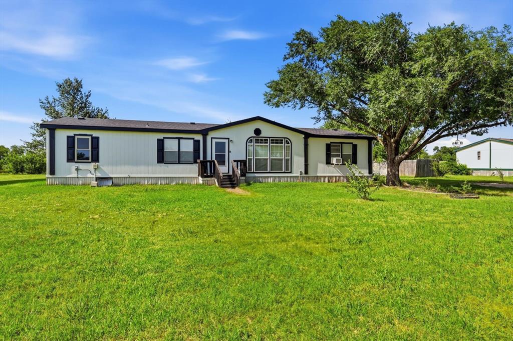 Well-maintained and freshly painted modular home on an oversized 2.5-acre unincorporated lot in Sanger! This 3-bedroom, 2-bath home features an open-concept layout and is nestled among beautiful mature trees, offering exceptional privacy and plenty of room to enjoy country living. The cross-fenced property is ideal for horses or other livestock and includes a functional storm cellar, large storage shed and a water well. With ample space for a shop, garden, recreational activities, or future improvements, the possibilities are endless. This property has been meticulously maintained and is move-in ready. Schedule your showing today!