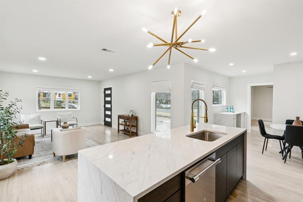 Fully renovated and move-in ready, this exceptional Cedar Crest property features a beautifully updated 3-bedroom, 2-bath main home plus a detached ADU with its own kitchen and bath, offering approximately 1,685 total square feet of versatile living space. Step inside to discover an open-concept layout with updated flooring, modern finishes, designer lighting, and a seamless flow between the living, dining, and kitchen areas. The stylish kitchen offers ample cabinet and prep space, while the primary suite provides a comfortable retreat with an updated bath. The detached casita creates endless possibilities as a guest suite, multigenerational living space, private office, long-term rental, or short-term rental opportunity. Additional highlights include no HOA, a spacious yard, and a prime location just minutes from Downtown Dallas, Bishop Arts, shopping, dining, and major highways. Rarely do fully renovated properties with a detached ADU, income-producing potential, and flexible living options become available in the historic Cedar Crest neighborhood. Seller is motivated and welcomes all offers.