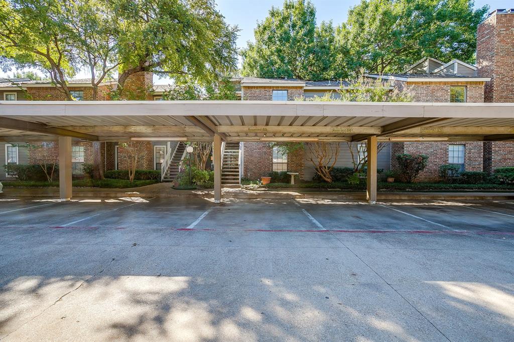 Spacious 2 bedrooms and 2 bathrooms ready for move in.  This cozy but spacious condo has an open living concept and spacious closets, bathrooms and bedrooms.  The patio balcony is private and serene with a nice view.  The parking is a few steps away and covered for convenience. New paint in October 2025, dark hard wood floors, granite countertops, new refrigerator. Both bathrooms have been remodeled, tub in master, backsplash and commode replaced in 2023. Very convenient location, just a few miles from GM headquarters, UTA DFW airport, Arlington professional sports and Texas Live.