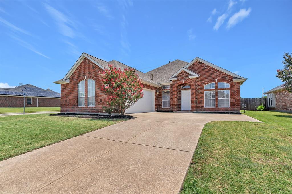 Pride of ownership shines through in this 3 bedroom, 2 bath home! Step inside this move-in ready, to experience the open living and brand-new LVP flooring throughout. The heart of this home is the large kitchen with natural light and tall ceilings hosting a dedicated breakfast bar, central island and dining area open to the main living areas, perfect for entertaining! Adjacent to the kitchen is a full-sized walk-in utility room with storage and an additional pantry. Overlooking the kitchen is the living room with incredible vaulted ceiling and gas fireplace. Spacious flex room for home office or formal dining is perfectly placed across from the kitchen and off the front entry. The primary bedroom of this home has a large walk-in closet and private ensuite with dual sinks and relaxing garden tub. The additional bedrooms are great size with large closet space and ceiling fans. This home sits just minutes from major arteries like Interstate 20 and Highway 360, ensuring swift commutes in the DFW metroplex. This corner lot property is a unique find with no back neighbor or HOA. Residents appreciate nearby schools, shopping, restaurants, and more. Come see this home and make it yours!