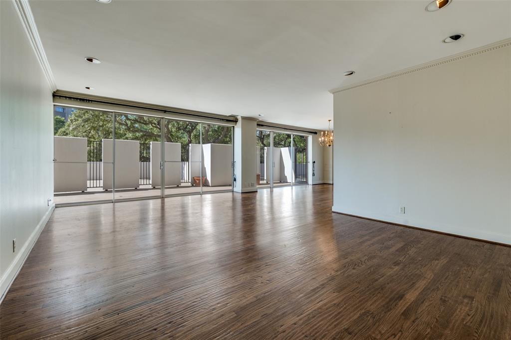 Experience elevated living at the iconic Gold Crest Condominium, nestled in the heart of Turtle Creek, ust minutes from the Katy Trail, West Village, and Highland Park. Step inside this elegant residence to find a spacious, light-filled layout enhanced by floor-to-ceiling windows that frame tranquil views of lush greenery. The home’s signature wrap-around terrace, accessible from nearly every room, creates a seamless indoor-outdoor living experience, perfect for both relaxing and entertaining. The well-appointed kitchen features stainless steel appliances, a double oven, and generous cabinet space to meet all your culinary needs. The primary suite offers a luxurious retreat with an ensuite bathroom featuring a separate tub and shower, along with two expansive walk-in closets. A versatile den adds flexibility, ideal for use as an additional living area, home office, or guest room. Residents of Gold Crest enjoy a wealth of amenities, including 24-hour concierge and security, valet parking, a fully equipped fitness center, a resort-style swimming pool, and guest suite accommodations. Discover timeless sophistication and effortless comfort in one of Dallas’s most distinguished addresses.