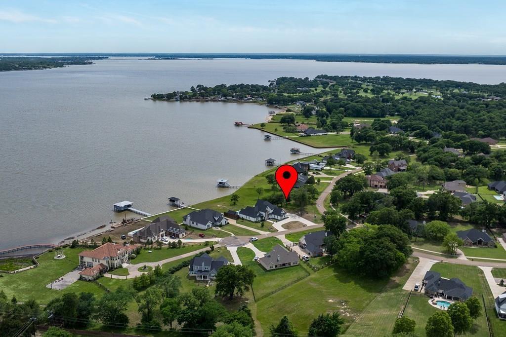 BUILD YOUR DREAM LAKEFRONT RETREAT on this exceptional 0.72-acre open water lot in gated community on Cedar Creek Lake. Breathtaking, unobstructed water views are the perfect backdrop for sunrise mornings, peaceful evenings, and true lakeside living. Surrounded by beautifully crafted high-end homes, this is an ideal setting to build your custom luxury lakehouse (3,000 sf minimum). Enjoy the best of both worlds with a prime location approximately 45 minutes from the DFW Metroplex, making weekend getaways or full-time lake living both convenient and accessible. This premier homesite also offers adjacent access to Cedar Creek Country Club, where members enjoy an 18-hole golf course, resort-style pool, tennis courts, clubhouse, and fine dining (membership required). Local high-quality builders available to bring your vision to life, ask about one-time close financing options with preferred lenders to simplify your build process start to finish.