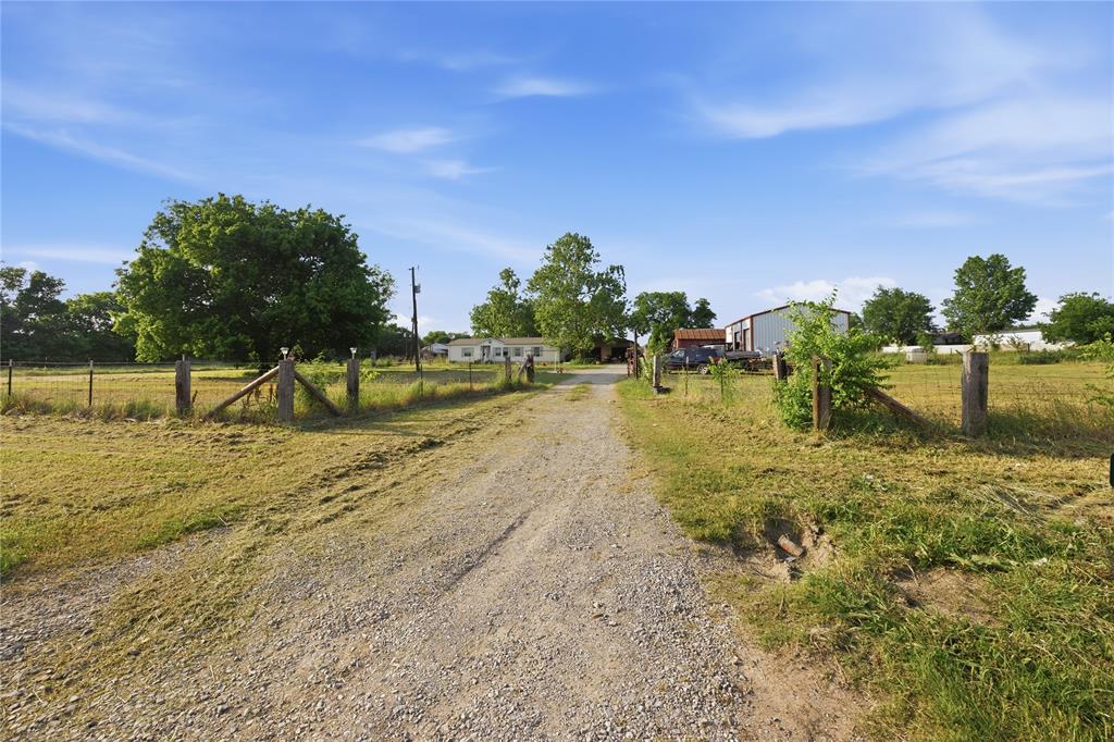 3-bedroom, 2-bath home on 10 ACRES in Grayson County, offering privacy, space, and flexibility just outside Denison. The property allows horses and features wide-open land ideal for livestock, recreation, homesteading, or long-term investment. The home offers approximately 1,553 square feet with a functional layout and natural light throughout. Key updates include two septic systems (certified approx. 4 years ago), roof approx. 5 years old, and water heater approx. 2 years old. HVAC condition is unknown; window units are currently in use. The property is set back from FM 120, providing a peaceful setting while still offering convenient access to Denison, Sherman, and major roadways. A rare opportunity for buyers seeking acreage, freedom, and long-term value in a growing North Texas area.