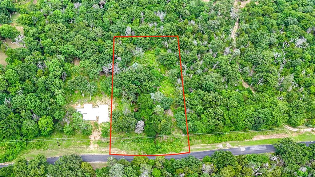 Escape to peaceful lake living with this beautiful 1.10-acre off-water lot located in the gated The Wilderness community on Richland Chambers Reservoir. Filled with mature trees and partially cleared for convenience, this scenic property offers the perfect setting to build your dream home or weekend retreat. A charming creek running through the property adds to the natural beauty and tranquil atmosphere, creating a private getaway surrounded by nature. Enjoy the serenity of the neighborhood while still being close to the lake and community amenities. The adjacent lot is also available for purchase under MLS #21277320 and already has foundation and plumbing work started, giving you the opportunity to expand your space or create a larger estate-sized property. Don’t miss your chance to own a slice of paradise near the lake!