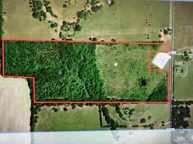 Great opportunity to own a piece of land in rural America!  Take a look at this 53+ acres of prime land in Southern Red River County, Texas just minutes from Clarksville!  Carve out a space for a forever home back off the road or create the perfect place for a weekend getaway or hunting tract.  With both open and wooded areas, the possibilities are endless.  No restrictions. Water source is county water with 2 meters and waterlines in place.  Located on county farm to market solid surface road.  Partially fenced.  The area is known for its abundance of wildlife, turkey, deer and wild hog.  Property features 2 ponds.
