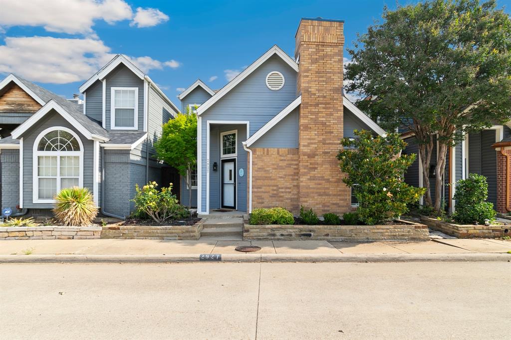 Get ready to Fall in Love! Cozy and beautifully maintained two story home tucked inside Northtown Square community in N Dallas. Sitting on a charming patio home lot offering easy maintenance living, private backyard, and all without giving up style, comfort, or character. From soaring vaulted ceilings to the cozy decorative wood burning fireplace which will definitely steal the show on those cool brisk evenings. Central Atrium and patio gives an abundance of natural light throughout the 1st floor! You'll feel the warmth and welcoming vibes from the moment you walk through the door. Rich wood floors and fresh paint throughout gives the home a bright and refreshed feel, while the pride of ownership is impossible to miss. The open layout flows perfectly for both everyday living and entertaining guests. Kitchen features stainless appliances, granite countertops, opens into the dining space, and offers just the right amount of charm and functionality. Plus, the refrigerator, washer & dryer stay! The downstairs spacious primary suite feels like a little slice of comfort with sliding glass doors leading to your private backyard patio. Primary bathroom offers decorative tile, granite countertops, dual sinks, large vanity, relaxing oversized garden tub with shower and Texas sized walk in closet space. Upstairs you will find a spacious loft area that makes the perfect play area, home office, or just comfy hangout space. Two secondary bedrooms and full bathroom complete the second level, giving plenty of spread room and comfortable space. Step outside and enjoy the low maintenance backyard, landscape beds and some grassy play space to relax and unwind. Every inch of this home has been lovingly cared for and it truly shows. This one is cute, cozy, comfortably functional, and move in ready all wrapped into one! Easy access to 635, 35, DNTollway, plenty of shopping, restaurants and conveniences for Today's Active Lifestyle!