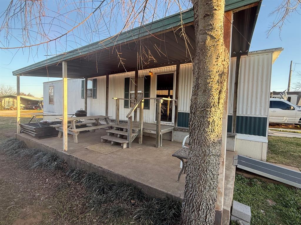 Two-bedroom one bath home with covered front porch with a view of beautiful Possum Kingdon Lake. The back entry has ramp for easy access. This home is perfect for your weekend get a way or for full time living. This property is not deeded. The land lease is currently 7200.00 for the year which includes mowing of the yard, A dish TV package, trash and water. Boat slips available for rent by the day, month or year.
Lot size is not listed in the tax records; you will need to verify with the Sky Camp owner.  Also tax record shows this to be unit 7, however the Sky Camp owner says it is unit 12.