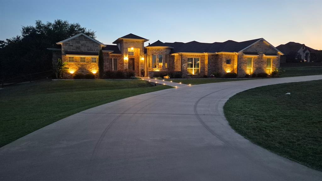 Best deal in Rolling Creek Ranch!  This exceptional custom-built home on 2.1 acres offers a rare blend of refined luxury, thoughtful design, and serene living. Boasting four spacious bedrooms and four beautifully appointed baths, the home is perfectly suited for both everyday comfort and modern entertaining.  The primary suite is a must see and includes dual closets, separate vanities, oversized dual shower and a flex space to include a stackable washer-dryer or enough space for a safe.  
At the heart of the residence is a chef’s kitchen designed to impress, complemented by an oversized pantry, a dedicated wet bar area, and seamless flow into the main living space— showcasing tranquil views of the backyard oasis.  A separate office provides an ideal work-from-home experience.
Step outside to your own resort-style oasis, where a sparkling pool controlled electronically, is framed by mature trees that creates a stunning natural backdrop while ensuring exceptional privacy. A covered porch with an outdoor grilling area along with a separate stone fire pit that invites year-round entertaining and relaxed evenings under the Texas sky.  Surround sound in living and back patio.  
With its unparalleled setting, thoughtful layout, and one-of-a-kind charm, this remarkable property offers a lifestyle that is both elevated and peaceful—truly a rare find in today’s market.  Neighborhood has two entrances for easy access and there are no city taxes.