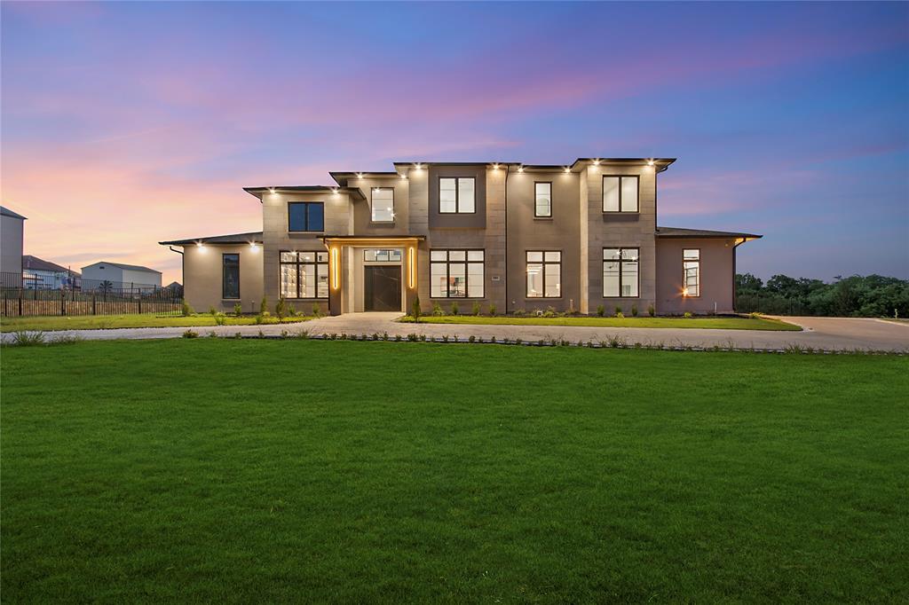 Set on over 1.11 acres of pristine land in a private, gated community, this extraordinary custom-built home blends timeless craftsmanship with cutting-edge modern luxury. Offering more than 5,100 square feet of meticulously designed living space, every element of this residence exudes sophistication, comfort, and innovation. Graceful architecture and elevated finishes define the interior, which includes four generously sized bedrooms and four and a half beautifully appointed bathrooms. Two distinct living areas provide versatility for entertaining or quiet relaxation, while a private office offers a space for work or study. The expansive media room, outfitted with a state-of-the-art surround sound system, delivers a truly immersive, theater-quality experience. Throughout the home, advanced technology and automation systems enhance everyday living: controlling lighting, audio, climate, security, and more with ease. This is true smart home living, designed for convenience, efficiency, and modern lifestyles. The chef's kitchen boasts commercial-grade appliances, designer hardware, and an oversized island perfect for entertaining. The resort-style backyard is complete with a pool, spa, waterfall, and outdoor kitchen. This home offers luxury, privacy, and innovation in a serene setting.