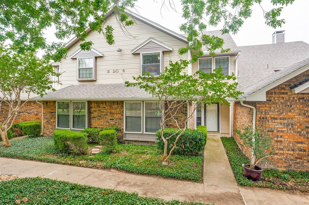 Updated and move in ready, this beautifully renovated townhome combines modern style with an open, airy layout in a convenient Carrollton location. Soaring ceilings and abundant natural light create an inviting living space centered around a cozy fireplace, while the loft overlooking the family room provides the perfect flex space for a home office, second living area or an exercise space. The fully remodeled kitchen has been opened to the dining and living areas, creating exceptional flow for everyday living and entertaining. It features granite countertops, updated cabinetry, breakfast bar seating, and generous prep space. Throughout the home, carpet has been replaced with engineered wood flooring, with tile flooring in both bathrooms for a cohesive, low-maintenance finish. The desirable floor plan offers two spacious bedrooms and two full baths, including a private upstairs retreat. A rear-entry two-car garage provides ample storage and convenience. Ideally located near shopping, dining, and major highways, this updated townhome offers comfort, style, and easy living.