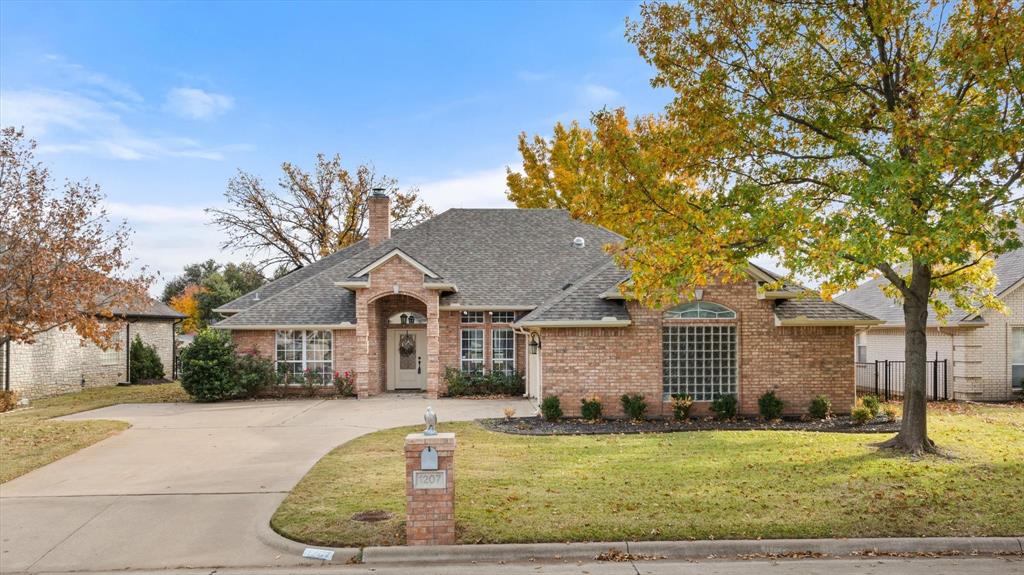Massive Price Improvement!  Wouldn't it be great to have free electric bills!  This house delivers with almost new solar system.  Run the HVAC as much as you want and discover what solar can do. Discover lakeside living at its finest in this exceptional one-story brick home nestled in Granbury, TX. Boasting a smart layout that spans 2,454 square feet, this residence offers four cozy bedrooms and two well-appointed bathrooms. The primary bedroom, split from the others for privacy, features access to the serene outdoor spaces. Step into the heart of the home via an open kitchen, complete with stainless steel appliances, custom white cabinetry, and a large island equipped with a secondary sink — perfect for those who love to entertain or simply enjoy culinary adventures. Adjacent to the kitchen, you’ll find a convenient utility room with its own sink and ample cabinetry. The enclosed back patio provides an additional space for gatherings, while large windows throughout the home flood the spaces with natural light. Outdoors, the meticulously maintained landscape surrounds a transformed boat dock, now a relaxing lounging deck overlooking the lake. The dock is very easy to revert back to a boat dock,  it promises endless water fun.