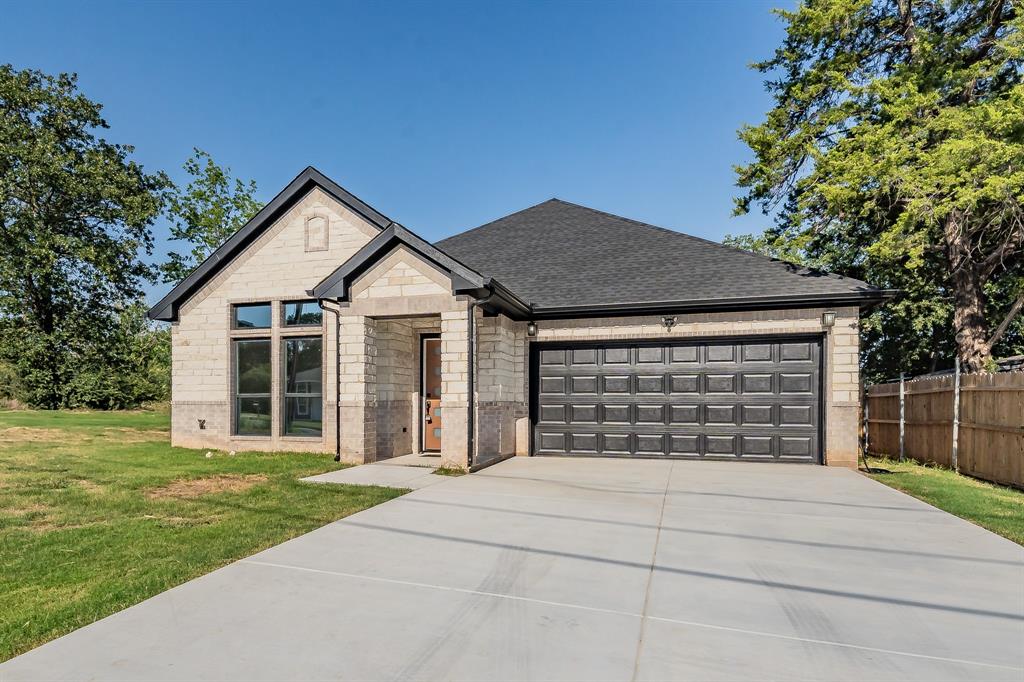 MOVE-IN READY!
This stunning home was built in 2024 and offers 3 bedrooms, 2 full bathrooms, and a spacious open-concept design perfect for modern living. From the moment you arrive, you’ll be captivated by the striking stone exterior, contemporary front door, and sleek black-trimmed accents that set the tone for what’s inside.

Step through the entryway to find luxury vinyl plank flooring throughout, designer lighting, and expansive windows that flood the space with natural light. The gourmet kitchen is a true showstopper — featuring granite countertops, custom cabinetry, a large center island with sink, and stylish pendant lighting — perfect for both everyday meals and entertaining guests.

The split-bedroom floorplan ensures privacy, with a generous primary suite offering a spa-like ensuite bath complete with double vanities and a beautifully tiled tub-shower combination. Secondary bedrooms are perfectly suited for family, guests, or a home office. Additional highlights include a dedicated laundry room with built-in shelving, modern ceiling fans, and a fully fenced backyard ready for outdoor enjoyment.

Situated in a desirable neighborhood with quick access to schools, shopping, and major highways — this home is 100% move-in ready. Everything is new, fresh, and waiting for an owner.
Schedule your showing today — this one won’t last!