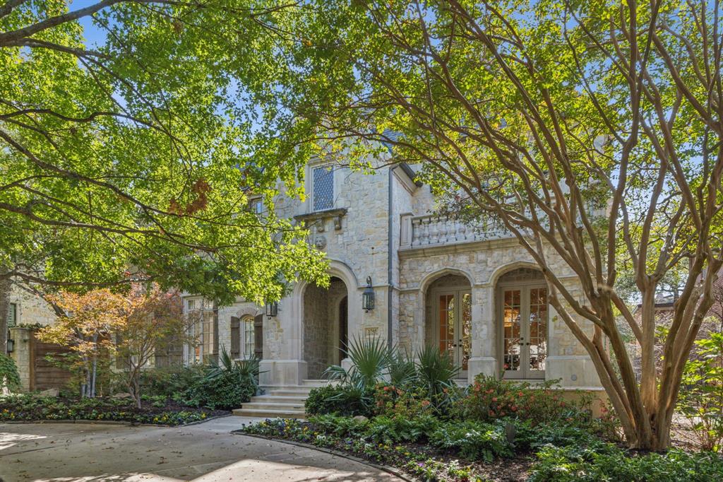Nestled on a highly sought-after street in Highland Park, this classic English stone manor built by Gage exudes sophistication with its elegant transitional interior. Upon entry, the formal dining room and living room with fireplace frame the foyer. A discreet powder room is tucked near the entrance. The front hallway gracefully leads to a wet bar and a versatile library, home office, or mahjong room, which opens onto a charming stone patio that accesses the serene side yard. The exquisitely renovated kitchen, complete with a butler’s pantry, flows into a spacious family room, also featuring a fireplace. A second powder room and a two-car garage offering ample storage and epoxy flooring complete the first first floor.

French doors from the family room invite you to a peaceful covered porch, overlooking a meticulously landscaped backyard with a newly renovated pool and spa, all elegantly encircled by stunning limestone.

On the mezzanine level, one will discover utility and game rooms, accompanied by a convenient study nook. The second floor is home to a sumptuous master suite, featuring a beautifully appointed bath and his-and-her closets. Three additional ensuite bedrooms and a cozy reading nook complete the second level. The third floor offers a fifth generously-sized ensuite bedroom, complete with a sitting area. This exceptional residence is truly a must-see, epitomizing the perfect blend of elegance and modern luxury.