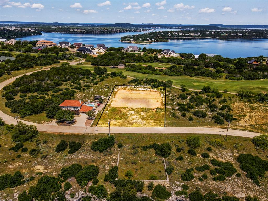 Rare fully prepped build site on a premium golf course double lot with expansive Palo Pinto Mountain and valley views inside The Cliffs Resort. Positioned directly along Hole 5 of the award-winning 4-star championship golf course, this exceptional property offers a major head start on construction with extensive site preparation already completed. Approximately 90% of the homesite has been professionally hammered out of rock and flattened, building pads have already been started, and nearly 60 loads of select fill have been brought in to create an outstanding foundation for a future custom home. Water and electricity have already been run to the property, significantly reducing the time, cost, and effort typically associated with building in the area.

This rare double lot combines breathtaking scenery, golf course frontage, privacy, and usability in one of Possum Kingdom’s most desirable resort communities. Builders home plans are available for buyers looking to fast-track the process, or design and build your own custom luxury retreat tailored to your vision. Whether you are planning a full-time residence or weekend lake escape, opportunities to purchase a fully improved double homesite with utilities in place and panoramic mountain views inside The Cliffs are becoming increasingly difficult to find.