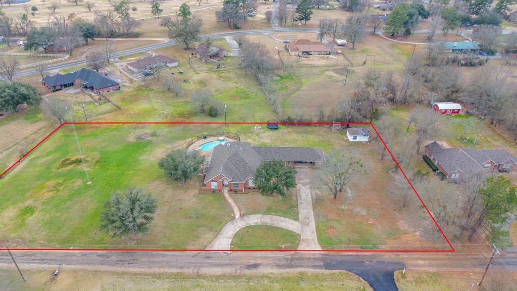 Welcome this this bright and spacious home designed for comfort, flexibility, and room to grow, all set on 1.7 beautiful acres and located outside city limits. Boasting 5 bedrooms, multiple oversized living areas, tall ceilings, and abundant natural light throughout, this home feels open, airy, and welcoming from the moment you step inside. The large bonus room provides endless possibilities; game room, home gym, media space, or additional living area. This space makes it easy to tailor the home to your lifestyle. Recent updates include new LVP flooring, adding durability and a fresh, modern touch. The expansive kitchen is a true standout, featuring ample cabinetry and generous countertop space, perfect for hosting gatherings or enjoying daily meals at home. Step outside to enjoy your private outdoor retreat featuring a well maintained pool and inviting patio area. The outdoor living area is perfect for relaxing, hosting gatherings, or soaking up warm Texas days. With generous indoor and outdoor space, excellent natural light, and a desirable location near Sand Hills Golf and Country Club, this property delivers the perfect blend of comfort, functionality, and peaceful country living. A real dream come true, schedule your tour today!!