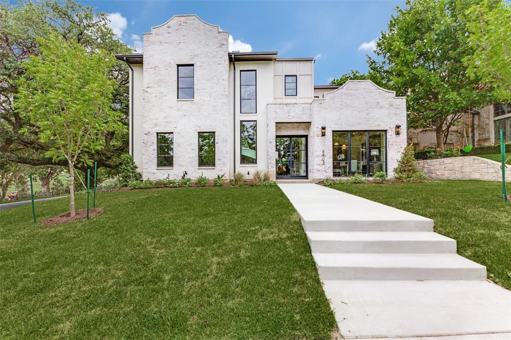 Welcome to 6803 Casa Loma Ave, a stunning new construction in Lakewood’s coveted C Streets, ideally situated on a corner lot with golf course views across from Lakewood Country Club. Thoughtfully designed with a warm-modern aesthetic, this custom home pairs timeless style with exceptional function, creating a truly elevated living experience. Offering 4,842 square feet, this residence features a desirable first-floor primary suite, a spacious study, and a gorgeous living room with a full masonry fireplace that opens to a chef’s kitchen. The kitchen is complete with a large center island, Wolf range with six burners and griddle, abundant cabinetry, an oversized built-in refrigerator, designer tile, lighting, and more. A walk-in pantry and butler’s pantry lead to a beautiful dining area, making this home an entertainer’s dream. The first-floor primary bedroom is generously sized and connects to a private bath with an oversized shower, soaking tub, and designer finishes. The primary closet is also expansive and designed to accommodate even the most discerning buyer. The main level is completed by two half baths, a large laundry room, a mudroom, and access to a fabulous three-car garage. Upstairs, you’ll find a large second living area-game room, three oversized secondary bedrooms, each with en-suite bathrooms, plus a convenient half bath and second laundry closet. Outside, the home is beautifully landscaped and offers a 393-square-foot covered patio with a fireplace overlooking a large backyard, ready for its new owners.