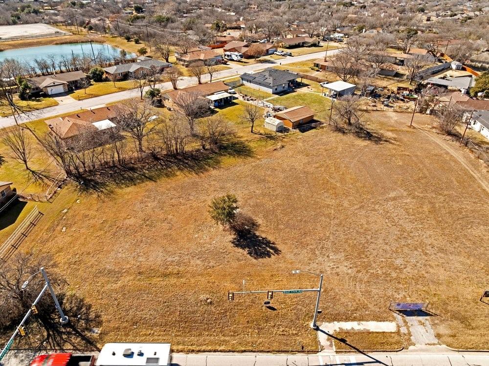 Commercial Opportunity on Boat Club Road – Fort Worth, TX

Located in the heart of Fort Worth, this commercial property offers an excellent investment opportunity in a high-visibility, high-traffic area along Boat Club Road. The ±0.622-acre site benefits from strong exposure and convenient access, making it well suited for a variety of commercial and mixed-use development options.

Zoned PD-702 Special District with allowed uses including industrial, mixed-use, and commercial (buyer to verify), the property offers flexibility for a range of potential business applications.

Surrounding businesses include medical and dental offices, health and fitness centers, title companies, restaurants, financial institutions, and retail establishments, creating a well-established commercial corridor with consistent activity and demand.

The property provides easy access to Loop 820 and a direct route to downtown Fort Worth, enhancing connectivity and convenience. Positioned in an area experiencing continued growth, this location presents strong potential for development or long-term investment.

Buyer to verify zoning, utilities, restrictions, and intended use.