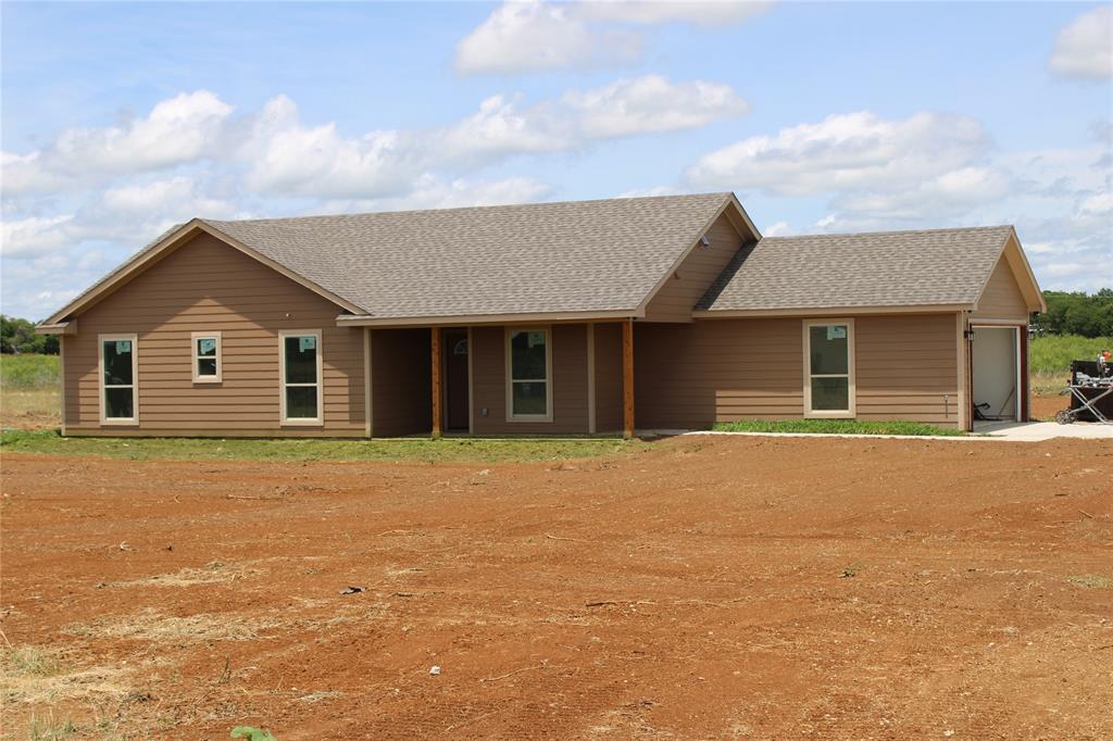 What a fantastic home plan on 3.5 acres right here at the edge of town where you can have FFA animals on your own property. This is a great 3-2-2 new construction home on acreage that you don't want to pass up. This floor plan has 3 nice size rooms, master has a tub and a walk in shower with a his and hers closets. Nice open floor plan with covered back porch and front porch.  Plenty of room on your property to have a metal shop or barn and your horse so come on out and take a look at this new home. Home has city water, septic system. Other lots available to build on up to 6 acres so see what is new in Jacksboro. Home is in the final stage of construction so will be move in ready soon. More pictures to come when finished.