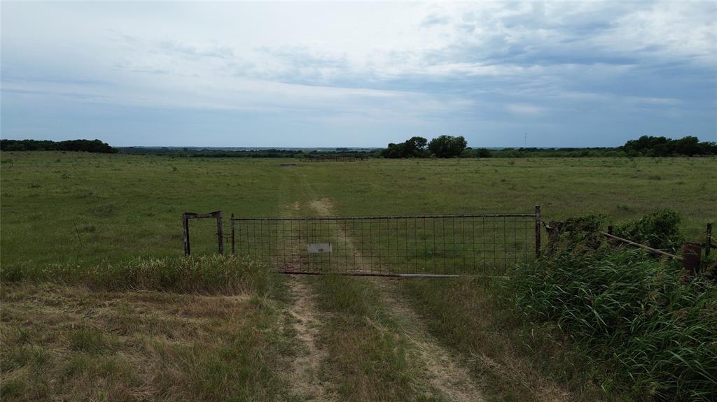 Exceptional 202 acre ranch in Hill County offering a rare combination of productive agriculture, cattle operations, recreation, and outstanding homesite potential. The property features excellent native grasses ideal for grazing, approximately 90 acres of cultivated ground currently planted in corn, and roughly 30 acres of wooded cover with a mix of hardwoods and mesquites, providing excellent wildlife habitat.

A year-round stocked tank offers dependable water and excellent bluegill fishing, while more than 60 feet of elevation change creates scenic views and multiple potential build sites for a custom ranch home. The pastureland is cross-fenced separately from the cultivated acreage, making the property well-suited for an active cattle operation.

Wildlife is plentiful, with a small population of whitetail deer and an abundance of doves year-round, making it an exceptional hunting and recreational property. Good perimeter fencing is already in place and adequate for livestock. Access is provided by deeded easement via a dirt road off North County Road 3110.

Whether you are looking for an income-producing agricultural investment, a working cattle ranch, a hunting retreat, or the perfect place to build your dream home, this highly diverse property offers endless possibilities. Mineral rights are negotiable.