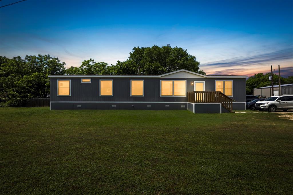 This property has road frontage on FM 1187 and features a new double-wide mobile home. The property is adjacent to three others that can be sold individually or as a package together; MLS numbers are 21277507, 21277512, 21277520, 21277530. The mobile home has neutral paint and finishes throughout with wood-look laminate flooring, ceiling fans and is ready for you to call it home!  The property is located outside of city limits but is zoned for Burleson ISD. The property is tenant occupied and can be shown with 48 hours notice. Don't miss your chance to purchase this great property!