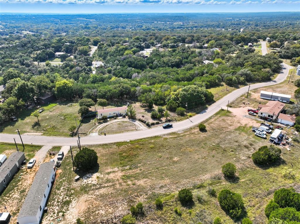ARROWHEAD SHORES IS A GREAT PLACE TO LIVE ON LAKE GRANBURY WITH ALL THE AMENITIES OF LAKE LIFE AND THAT COUNTRY FEEL WITH EASY ACCESS TO DFW AND ONLY MINUTES AWAY FROM THE GRANBURY HISTORIC SQUARE DISTRICT. Buyer to verify the accuracy of all information including room & lot sizes, schools, taxes, amenities, etc. Neither Seller nor Listing Agent make any warranties or representation as to accuracy. Survey available.