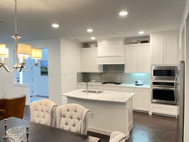 Modern design.  Bright, clean corner townhouse with tons of windows and natural light.  Only 1 shared wall (see pics).  1st floor boasts open floor plan, vaulted 2 story entry, kitchen has carrera marble countertops (refinished 11 2023). Rich looking dark wood flooring.  Perfect little semi-hidden computer, desk, mail area right behind the dining room. Second floor has master bedroom separate (opposite side of unit) from other 2 bedrooms.  Second living area is between separated bedrooms.  Cozy, bright area with built in sitting area.  Unit feels like new.  Energy efficient low bills.  Single bachelor has been the only occupant since 2018, no pets ever.  Barely lived in.  Highway 75 and George Bush turnpike are minutes away.  Tons of restaurants and groceries minutes away.  Unit overlooks greenbelt.  Pets are on a case by case basis.  Owner would perhaps consider renting unit furnished for a higher price.  Applicants must credit qualify.  Cost is $35 per person over 18 years of age.
