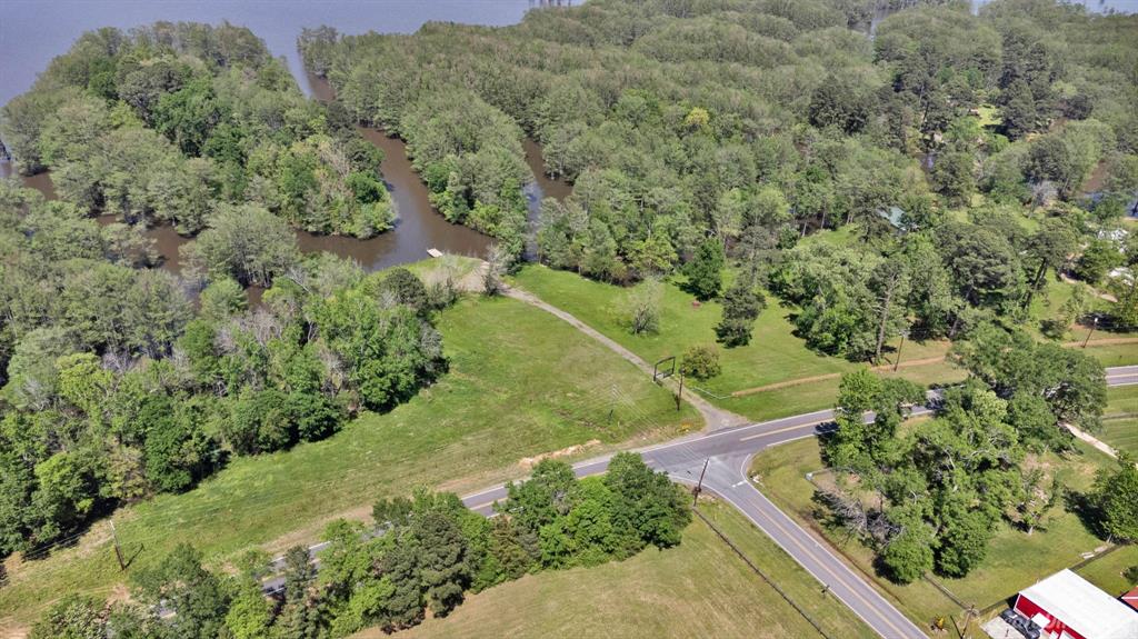 Cypress Alley – A Rare Opportunity on Cross Lake

Discover over 3 acres of waterfront potential with Cypress Alley, boasting approximately 1,100 feet of lake frontage on scenic Cross Lake. Nestled at the end of Jolly Napier Road on South Lakeshore Drive, this property holds deep roots in local history—originally established in 1938 as Loyd’s Landing, one of the area’s earliest marinas.

While all original structures have been removed, the land is ready for redevelopment. Improvements include a rebuilt seawall, a concrete boat launch, and a deepened harbor for year-round access.  A brand-new fence stretches along the right side of the property, while a handcrafted Cypress Alley entry gate adds both charm and distinction to the entrance. With its iconic cypress tree-lined inlet, this land offers endless possibilities—whether you're envisioning a private estate, boutique marina, or lakefront business venture.

A rare chance to own a piece of Cross Lake history —Cypress Alley is ready for its next chapter.

Approximately 3.2 acres are deeded and approximately 5 acres are usable to the new owner.  Minerals will be transferred and are producing.
