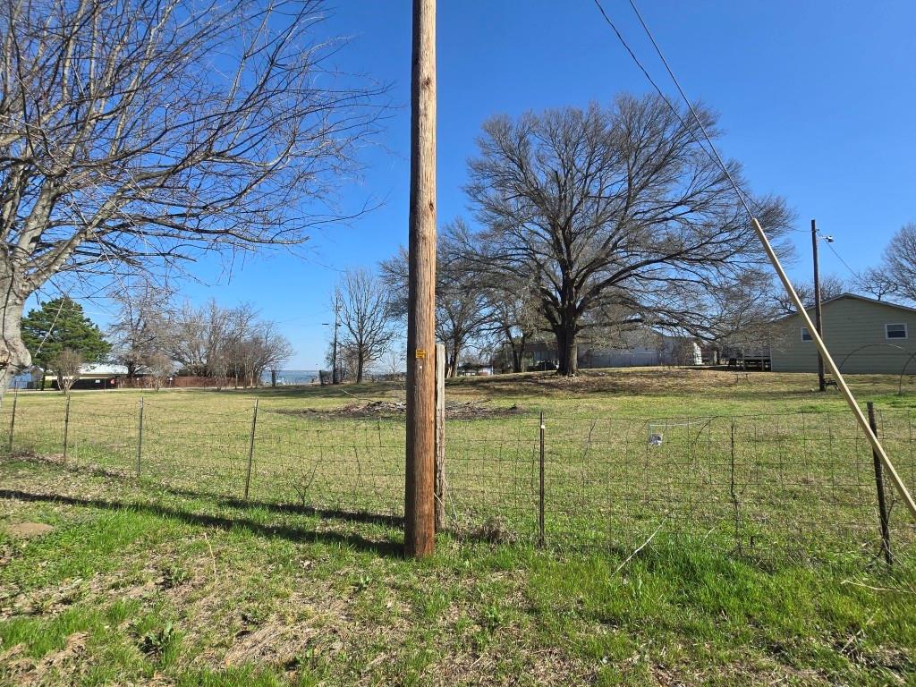 ALL LOTS ARE UNDER ONE FENCE, LOT 7 BLK 3A IS PAST THE CORNER AND SIGN IN YARD, BUYER NEEDS CULVERT AND UTILITIES ARE AVAILABLE AT STREET.  THIS LOT CAN BE PURCHASED WITH LOT 8 BLK 3A . CLEARED LOT READY FOR BUILDING, ACROSS FROM WATER.  SEVERAL NEW HOMES IN THIS AREA HAVE ALREADY BEEN BUILT. DONT MISS YOUR OPPORTUNITY TO LIVE CLOSE TO LAKE, TVEC IS ELEC AND WCCMUD FOR WATER. BUYER WILL NEED TO ADD CULVERT, NO SURVEY.   SELLERS ARE LICENSED AGENTS IN STATE OF TX