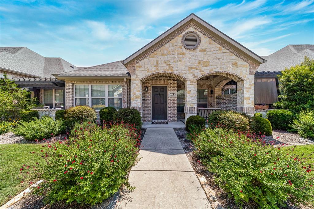 Welcome to this charming 2-bedroom, 2-bathroom townhome nestled in the beautifully maintained community of Villas in the Park in Fairview, TX. Designed for effortless living, this home features a single-story layout with no steps, ensuring easy entry and exit for total accessibility. Step onto the inviting covered front porch, perfect for morning coffee or relaxing evenings, and enter a meticulously maintained open floor plan featuring a neutral palette that complements any decor style. The living space is anchored by a custom built-in entertainment cabinet and bathed in natural light from a central skylight, creating a warm and airy ambiance. Significant recent upgrades include all-new high-end carpet and premium padding throughout, as well as a dining area specifically designed to accommodate a six-person table. The primary suite offers a relaxing garden tub and a spacious walk-in closet, while the private 2-car garage provides ample storage and convenience. Residents enjoy access to a premier amenity center with a workout room and pool, and the home is situated directly across the street from a park for peaceful outdoor escapes. Located with easy access to McKinney and Allen retail and dining, this townhome is an ideal choice for those seeking comfort and high-end finishes. Don’t miss the opportunity to make this lovely home your own—schedule your showing today!