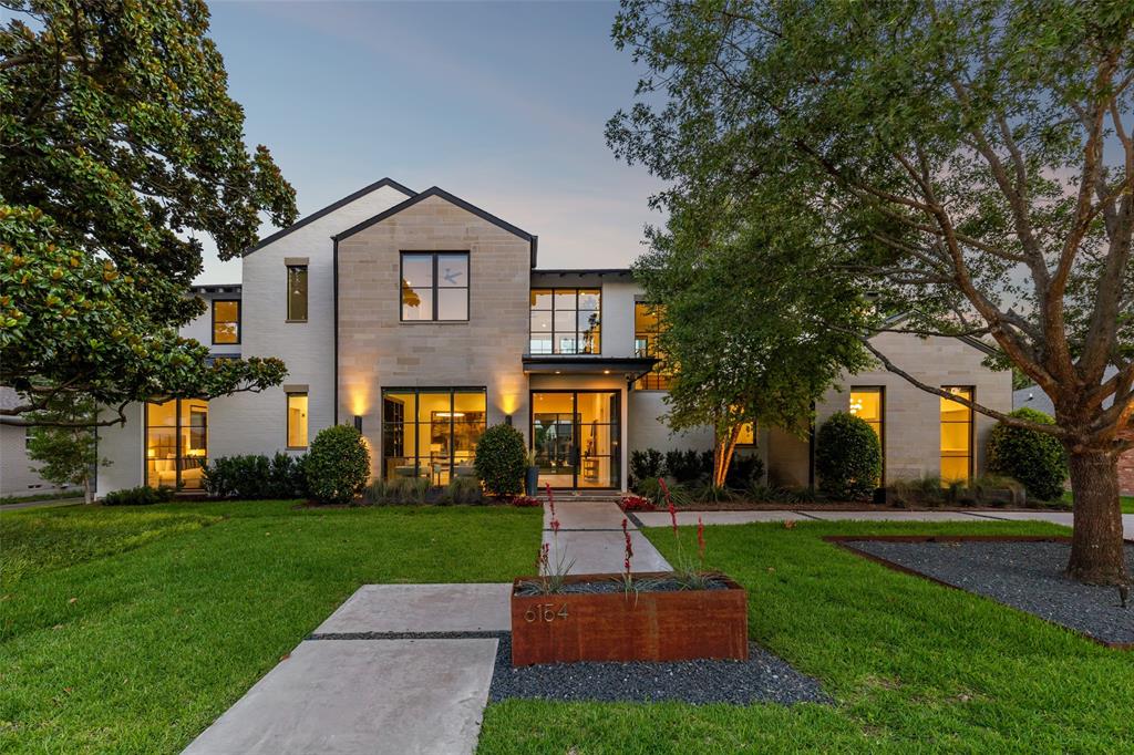 This handsome transitional style property with clean lines and walls of windows was built by Rosewood, located in Preston Hollow and offers the opportunity to own a home designed for gracious entertaining and casual living – all centered around a stunning resort style backyard. The home offers over 6,000 sf of living space and includes 5 bedrooms, 5.1 baths, an office, multiple living and dining areas, a flex space and the primary suite and a guest bedroom located on the first level. Enter the outdoor oasis through the oversized covered patio complete with fireplace and electric screens, then continue onto the pool with swim up bar, tanning ledge and water feature, a spa with infinity edge and fire feature, an outdoor kitchen pavilion, a putting green and a fire pit – all surrounded by an integrated sound system and dramatic lighting. The first level of the home features the main living space flanked with windows and open to a chef’s kitchen with top of line appliances, catering area and casual dining. The main dining area is the perfect space for a dinner party with a dramatic temperature-controlled glass wine closet, butlers serving area and views to the stunning backyard. The generous primary suite includes expansive windows overlooking the pool with a gorgeous bath featuring steam shower, separate closets and an integrated laundry room complete with refreshment bar. Ascend the light-filled staircase to the second level containing a generous central living space, 3 ensuite bedrooms and a mirrored flex space perfect for an exercise room. Wide-plank light oak wood flooring, remote-controlled window coverings, full-capacity back-up generators, integrated sound system and remote-controlled outdoor systems are some of the amenities included in this luxury living environment.
