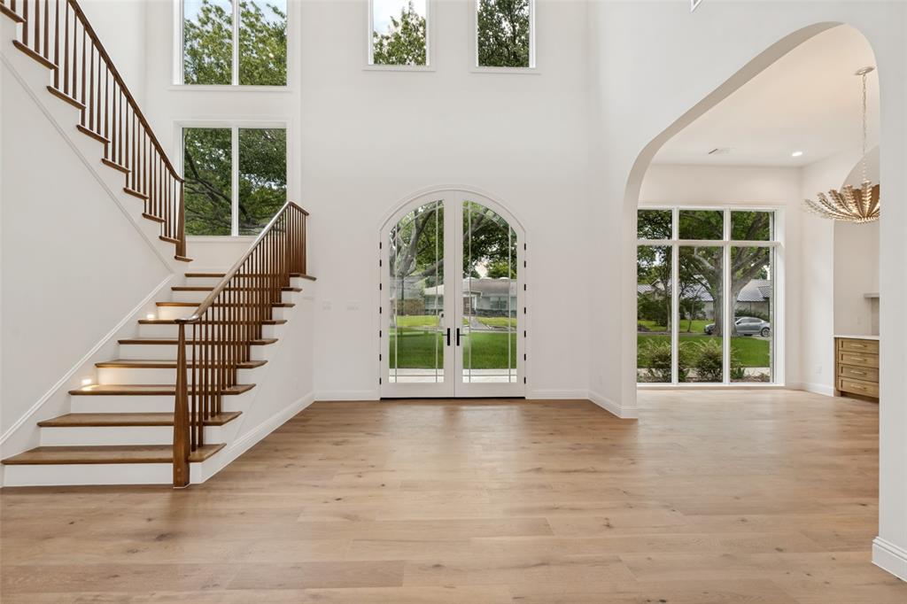 Contemporary new construction by Chellyanna Custom Homes in Preston Club Estates, ideally located within Dallas’ coveted Private School Corridor. Nestled among mature trees on a picturesque, tree-lined street, this approximately 6,700-square-foot home offers a light-filled floor plan designed for modern living and entertaining.

The first floor features a private study, guest suite, and spacious primary retreat with a spa-inspired bath. The open kitchen is designed for both function and scale, featuring double ovens, double dishwashers, dual sinks, an oversized island, custom cabinetry, a butler’s pantry, and a breakfast nook overlooking the pool and backyard. A spacious laundry room and mudroom add everyday convenience.

Upstairs offers four en-suite bedrooms, a large game and living area, a versatile bonus room, and an additional laundry closet. White oak flooring runs throughout the home. The covered patio overlooks a finished pool and generously sized backyard, offering outdoor space rarely found in homes of this size. Three-car garage. Conveniently located near Dallas’ premier private schools, dining, and shopping.
