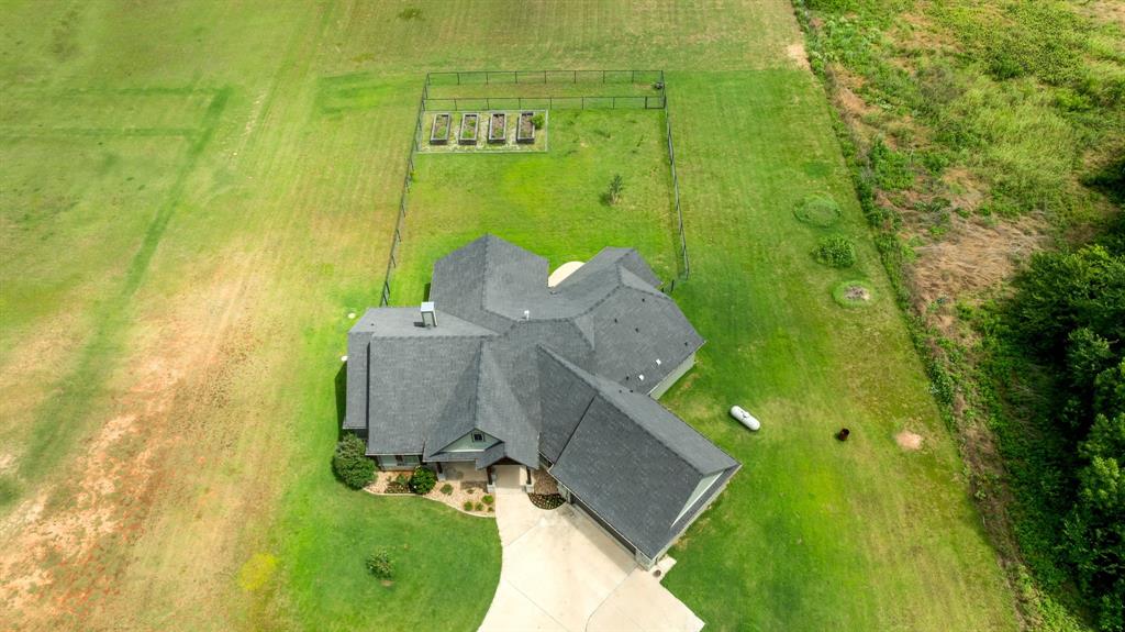 Experience refined country living in this beautifully upgraded custom home situated on 2 pristine acres with no city taxes and no PID or MUD taxes. Offering the perfect blend of modern luxury and peaceful rural charm, this property feels like a brand-new home with thoughtful updates and designer touches throughout.

Step inside to soaring vaulted ceilings, abundant natural light, and an open-concept floor plan designed for both everyday living and entertaining. The stunning kitchen serves as the heart of the home, featuring modern finishes, exceptional storage, and a massive walk-in pantry. Every space has been carefully curated to create a light, bright, and welcoming atmosphere with a sophisticated modern farmhouse feel.

The private primary suite is a true retreat, complete with its own fireplace, spa-inspired bath, oversized custom closet, and the ultimate convenience—a direct connection from the closet to the laundry room. Spacious secondary bedrooms, a dedicated study, and generous living areas provide flexibility for work, family, and guests.

Outside, enjoy the beauty of country living from the expansive covered patio, ideal for relaxing, entertaining, or taking in spectacular Texas sunsets. Raised garden beds, newly planted fruit trees, and plenty of room for animals, hobbies, or future additions make this property as functional as it is beautiful. A whole-house generator provides peace of mind and uninterrupted comfort year-round.

Conveniently located just minutes from Highway 114, with easy access to Decatur, Bridgeport, shopping, dining, and commuting routes, this exceptional property offers the rare opportunity to enjoy modern luxury, acreage, and privacy without sacrificing convenience.

This is more than a home—it’s a lifestyle.