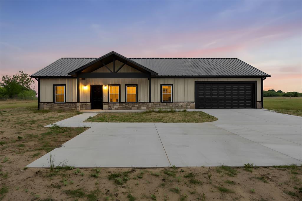 A little slice of Texas heaven on 2 acres! This gorgeous 3-bedroom, 2-bath barndominium with a 2-car garage is fenced with a beautiful black metal fence and ready for its new owners. The open-concept kitchen and living area are perfect for entertaining or enjoying quiet nights at home. With wide-open country surroundings, no close neighbors, and big Texas blue skies, this one is a must-see!