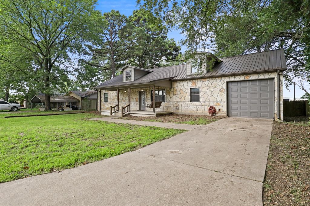 Charming Farmhouse-Style Home in Emory, TX

Welcome home to this beautiful 3-bedroom, 3-bath property full of farmhouse character and East Texas charm. Featuring a striking stone exterior and durable metal roof, this home offers both timeless appeal and lasting quality.

Inside, you'll find a spacious and functional layout, including two master suites, each with its own private bath—perfect for multi-generational living, guests, or added privacy. The inviting living spaces create a warm and comfortable atmosphere for everyday living and entertaining.

Step outside to enjoy the large, tree-shaded backyard, where you'll find a generously sized deck that's ideal for relaxing or hosting family gatherings. One end of the deck is partially covered, providing a comfortable outdoor retreat rain or shine. A storage building located in the backyard conveys with the property, offering additional space for tools, equipment, or hobbies.

Move-in ready and waiting for its next family, this home combines comfort, character, and outdoor enjoyment in a desirable East Texas location. Conveniently located in Emory, within Rains County, you'll be just minutes from renowned Lake Fork, one of Texas' premier fishing and recreation destinations. Rains County is often described as the gateway to Lake Fork, making this an excellent place to call home.