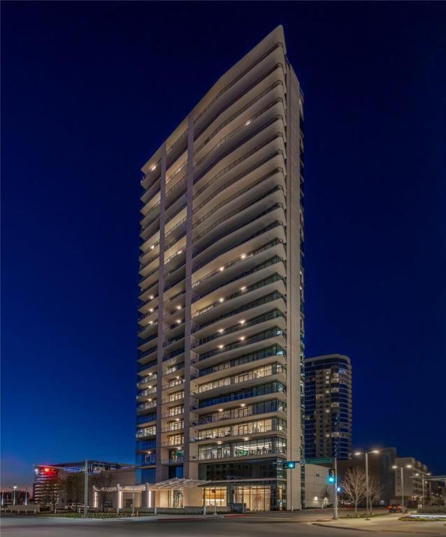 Experience Elevated Living at Windrose Tower! Perched on the 21st floor of the iconic Windrose Tower, this exquisite 2-bedroom, 2.5-bathroom residence with a study defines luxury living with panoramic, unobstructed sunset views over Lewisville Lake and striking vistas of downtown Dallas. Every detail of this home has been masterfully designed for the discerning buyer seeking comfort, elegance, and sophistication. A spacious, open-concept floor plan is bathed in natural light and seamlessly integrates the gourmet kitchen, living, and dining areas—perfect for both everyday living and grand-scale entertaining. The chef’s kitchen is outfitted with a large island with seating, sleek custom cabinetry, and top-of-the-line Wolf and SubZero appliances. Adjacent, a built-in Cantoni entertainment center with fireplace creates an inviting ambiance for relaxed evenings or hosting guests. Designed for connoisseurs, this unit boasts a custom bar and Cantoni wine storage capable of housing 600+ bottles—an entertainer’s dream. Smart living is effortless with the Control4 system offering integrated AV and whole-home audio throughout the condo. The Primary Suite is a true retreat, offering a spa-inspired bath with a soaking tub, oversized walk-in shower, dual vanities, and a luxurious magazine worthy Cantoni custom walk-in closet. A second bedroom with ensuite bath and an additional study provide versatility for guests or a refined work-from-home space. Step onto your private balcony with a gas fireplace to savor the awe-inspiring sunsets and skyline views that make this residence truly one of a kind. Additional features include two private garage spaces both equipped w-an EV charging station. Residents of Windrose Tower enjoy world-class amenities including a 24-hour concierge, private dog park next door, rooftop pool, state-of-the-art fitness center, business center, valet services & exclusive access to Legacy West, located just steps away. Welcome to effortless elegance in the sky.
