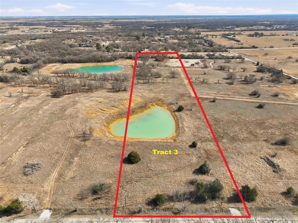 ACREAGE! Enjoy the freedom of country living on nearly 12 acres! Located outside city limits! With rolling hills, ponds and lots of trees, this spacious property offers the opportunity to build a custom single family home with well and septic or to run your own cattle. Mobile homes are not permitted. Deed restrictions apply, including limitations on the number of residential units per lot. Please contact listing agent for more information. Owner financing available! A rare opportunity to own acreage with space, privacy, and flexibility.