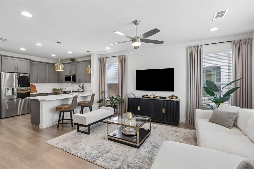 Experience sophisticated, low-maintenance living in this beautifully appointed townhome nestled within a desireable gated community with easy highway and shopping access. Enjoy the ease of HOA-maintained yard care, allowing you more time to relax and enjoy your home. 

Inside, the bright, open-concept design showcases stylish finishes throughout. The inviting living area features luxury wood-look vinyl flooring, a ceiling fan, and flows effortlessly into the chef-inspired kitchen, complete with stainless steel appliances, gas range, tile backsplash, breakfast bar, and a spacious walk-in pantry tucked beneath the staircase. A convenient half bath completes the main level.

Retreat upstairs to the serene primary suite, where you’ll find a spa-inspired ensuite bath featuring dual vanities, an oversized tiled walk-in shower, and a generous walk-in closet. A versatile loft with a built-in desk creates the perfect space for a home office, study area, or reading nook. Two well-appointed secondary bedrooms are thoughtfully separated from the primary suite, offering comfort and privacy for family or guests. An upstairs utility closet adds everyday convenience.

A rear-entry garage enhances both curb appeal and functionality, while the thoughtfully designed floor plan offers the perfect blend of elegance, comfort, and easy living. With the security of a gated neighborhood and maintenance-free landscaping provided by the HOA, this exceptional townhome offers the ideal lock-and-leave lifestyle. Schedule your private showing today and discover all this beautiful home has to offer.