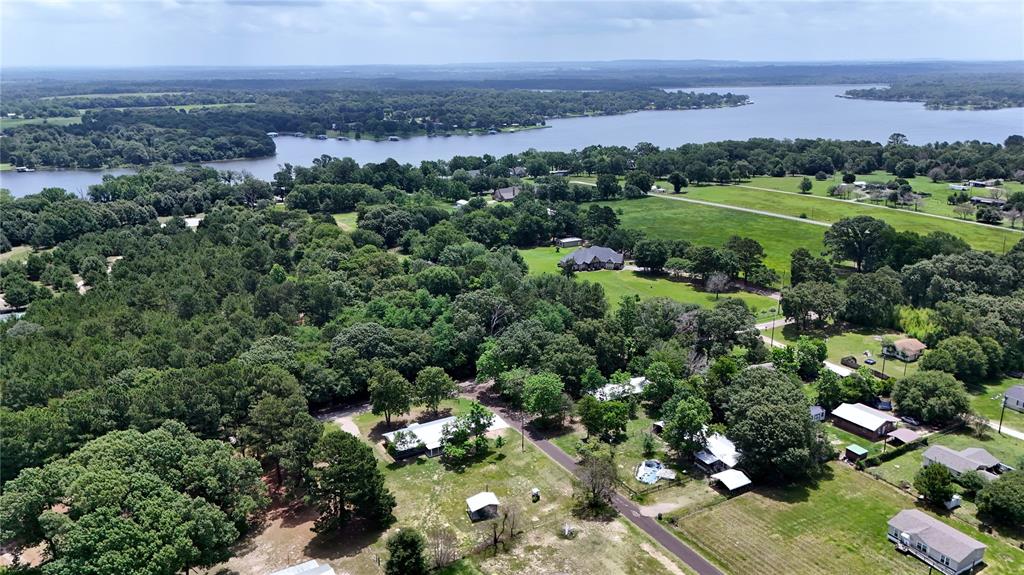 Completely renovated 4, 2, 2 cp, brick exterior, metal roof, cute she shed with lean to, large .84 acre corner lot, shade trees, many updates, open floorplan, 1,680 sf of living area, 2 covered porches, oversized 2 car carport.