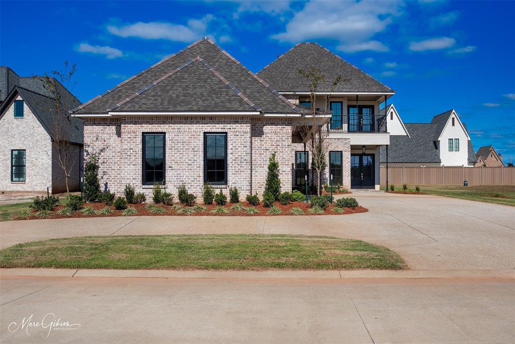 This breathtaking two story home blends modern French country elegance with timeless Southern charm, offering luxurious details and thoughtful design throughout.

Step into the grand foyer where a beautiful staircase sets the tone for what’s to come. The main level features two spacious bedrooms and 2.5 bathrooms, including a lavish primary suite with a massive custom closet, built-ins, and a separate section for long gowns, a true retreat.

Enjoy extra thick crown molding, a formal dining room with a custom accent wall, and a 3 car garage for ultimate convenience. The gourmet kitchen and open living space are ideal for entertaining and everyday comfort.

Upstairs, you’ll find two additional bedrooms, a large game room, an office flex space, and a walk in storage closet. One upstairs bedroom offers direct access to a private balcony, perfect for morning coffee or winding down at sunset.

This home is a standout in both style and function...don’t miss your chance to own this one of a kind masterpiece, oh and it’s located super close to a big golf course, Stonebridge!