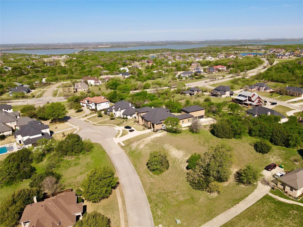 Build your dream home on this exceptional over an acre lot nestled in the prestigious Lake Ridge community. The elevation is positioned to provide the ideal canvas for a one-of-a-kind residence with impressive curb appeal and expansive outdoor living spaces. This homesite can offer a commanding presence and breathtaking views of Joe Pool Lake. In addition, you can gain both sunrise and sunset views creating a picturesque backdrop for luxury living. Connect to nature enjoying convenient access to hike and bike trails, boating, and fishing at Joe Pool Lake. This property is just a short drive from shopping, dining, and entertainment throughout the DFW area. Don’t miss your chance to create a personal retreat that truly has it all.