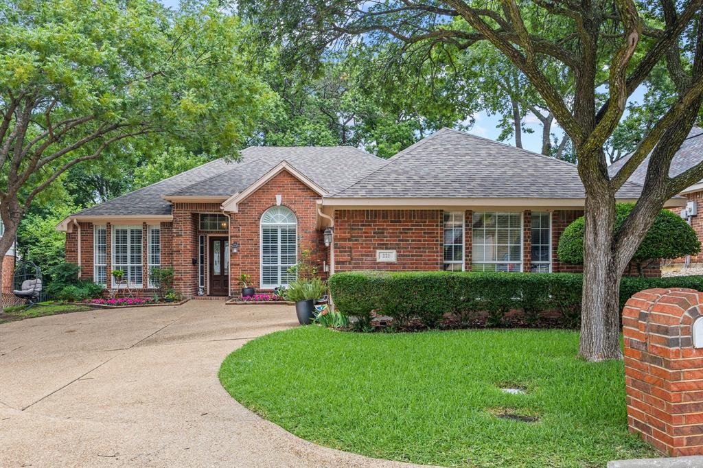 Beautifully maintained and thoughtfully managed, this 2,495 sq ft home sits in the highly desired, gated community of Chandlers Landing in Rockwall. Offering 4 bedrooms, 2 baths, and multiple living areas, it delivers comfort, flexibility and a serene setting surrounded by mature trees. Curb appeal begins with an oversized driveway, manicured landscaping and a 2-car garage. Inside, an open-concept formal dining and front living area provides a versatile space—ideal for a home office, second living room or game room. The kitchen is warm and inviting with granite counters, abundant storage including a center island, breakfast bar seating, gas cooking and double ovens. A neutral, cohesive palette flows into the main living room, anchored by a gas fireplace and framed by windows that bring the lush outdoor greenery inside. The spacious primary suite offers room for a seating area and includes an ensuite bath with double sinks, generous vanity space and an oversized roll-in shower. Three additional bedrooms share a second full bath, also appointed with double sinks for convenience. Step outside to split-level decking nestled beneath towering trees, creating a peaceful, nature-immersed retreat perfect for unwinding at the end of the day. From here, you’re just a short walk to Lake Ray Hubbard, where sunsets, shoreline strolls and marina views become part of daily life. Residents of Chandlers Landing enjoy a security-gated entrance, marina and boat slips, on-site restaurant, tennis and community pools, making this one of Rockwall’s most sought-after neighborhoods. Come experience the lifestyle and make this house your home.