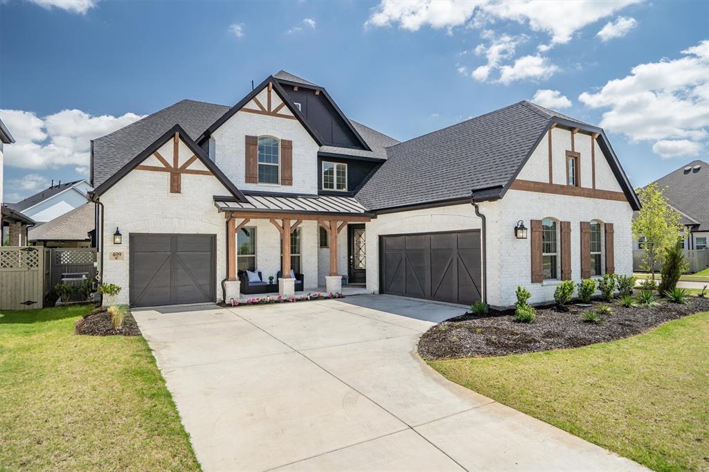 Welcome to this exceptional 5-bedroom, 5-bath luxury home in the highly sought-after master-planned community of Pecan Square, perfectly situated on a premium corner lot and offering an ideal blend of modern elegance, comfort, and convenience. From the grand sweeping staircase and soaring ceilings to the bright open-concept floor plan filled with natural light, every detail has been thoughtfully designed for everyday living and entertaining. The gourmet chef’s kitchen serves as the heart of the home, featuring a gas cooktop, oversized walk-in butler’s pantry, designer finishes, and a stylish coffee bar that flows seamlessly into the formal dining room. The main level includes a private home office, a luxurious primary suite with a spa-inspired bath and expansive walk-in closet, a secondary guest suite ideal for multigenerational living, and a convenient laundry room with direct access to the primary closet. Loaded with premium upgrades, this move-in-ready home features designer lighting, upgraded hardware throughout, a whole-home water filtration system, central vacuum system, and a Tesla charging station in the spacious 3-car garage. Upstairs, enjoy a large game room, built-in study workspace, dedicated media room pre-wired for surround sound, and three additional bedrooms, including a private en-suite perfect for guests or teens. Residents enjoy resort-style amenities including pools, a state-of-the-art fitness center, pickleball courts, co-working spaces, dog parks, walking trails, and year-round community events. Located within acclaimed Northwest ISD and zoned for the new Floyd Barksdale Middle School opening in 2026, this home is just minutes from shopping, dining, Tanger Outlets, Texas Motor Speedway, the new Tom Thumb, and major commuter routes, making it the perfect opportunity to enjoy luxury living, top-rated schools, and an unmatched North Texas lifestyle.