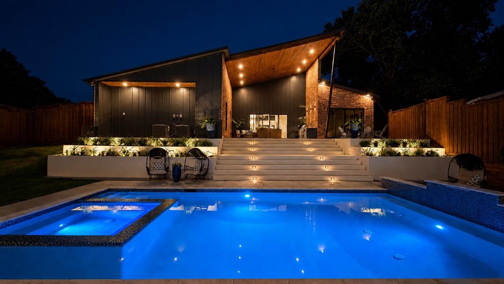 With 4,100 total SF (main home + guesthouse) of single-story new construction, this warm contemporary home (with a nod to its MCM ancestors) is ready for its first caretaker - the kind of person who wants their home to feel like a year-round retreat, grounded by natural light & incredible views.

Don’t miss the ultra-rare 1,186 SF guesthouse, steps from the resort-style pool, spa, & 500+ SF outdoor terrace, spanning a .41-acre corner lot. Perfect for multi-gen living, entertaining, WFH, or staycation vibes year-round.

Entertain with ease from the 20’ covered terrace, built-in gas BBQ, & outdoor refrigeration, all overlooking the stunning pool & spa.

Additional highlights include an 843 SF 3-car garage with side-mount Chamberlain openers, EV charger, Navien tankless water heater, & whole-home water filter. Outside you'll find custom corten steel planters, tiered concrete hardscapes, & drought-tolerant landscaping.

Tucked privately in the rear of the home, the primary suite features its own terrace, soaking tub, & custom walk-in closet.  Wake up to a spectacular view and direct access to the pool. A spacious secondary suite offers ideal flexibility.

Even the laundry room was thoughtfully designed with direct access to a separate fenced yard, DUAL stackable washer-dryer connections, and abundant storage.  The butler's pantry is plumbed for a secondary fridge.

Enjoy RISD schools & proximity to private schools, Northwood Country Club, and White Rock Trailhead. Quick access to 75, Coit, 635, & the Tollway.

If you want the quality & thoughtful detail of a custom home without the hassle or the wait, come experience this special property.

*MLS does not include guesthouse SF in price per SF.  Actual PPSF is $475 and doesn't take into account the .41 acre corner lot, extensive hardscaping & landscaping, new privacy fence, site-wide drainage, 843 SF 3-car garage, 500+ SF patio, pool, or hot tub, all backed by a 10 year third-party warranty.*