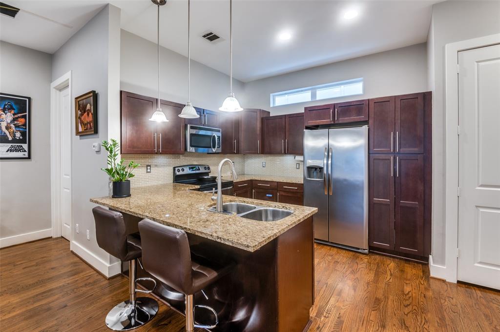 This is a fantastic condo in central East Dallas at a great price point. Walking distance to the shops and restaurants of Lower Greenville Avenue. Only minutes away from Lakewood, Uptown, and Downtown. The great floor plan includes a spacious open living-dining-kitchen area, a primary bedroom with a large attached bathroom, and a second bedroom with an ensuite bathroom. There is a sizeable entry area on the first level along with a walk-in storage closet. The complex is gated with rear-entry attached garages. Well-maintained with beautiful oak hardwood floors in the living areas. The kitchen has granite countertops, a breakfast bar, and plenty of cabinets.