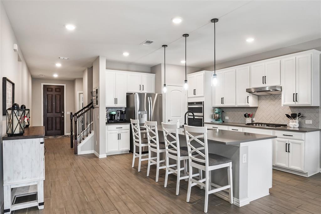 Welcome home to your like-new, move-in ready, single owner residence on a prime lot near the amenities center, in the sought-after Pecan Square community of Northlake, TX! This 4-bedroom, 2.5-bath home features a private home office, two living areas, and a spacious floor plan designed for modern living.

The open-concept main floor seamlessly connects the living, dining, and kitchen spaces — perfect for everyday living and entertaining. An entertainer’s dream, the kitchen showcases stainless steel appliances, a gas range, a large center island with ample prep and gathering space. After hosting friends and family, unwind in the private primary suite located at the rear of the home, complete with dual sinks, an oversized shower, and a spacious walk-in closet.

A dedicated office near the front entry provides privacy and flexibility for working from home, studying, or managing daily tasks, that could also double as a guest space. Upstairs, you’ll find three generously sized secondary bedrooms, a full bath, and a versatile second living area or game room ideal for movie nights, play space, or hobbies.

Residents of the award-winning Hillwood master-planned community, Pecan Square, enjoy resort-style amenities including pools with splash areas, a fitness center, community gathering spaces, pickleball courts, and an arena perfect for pick-up basketball games or neighborhood events. Conveniently located near major highways, shopping, and dining, this meticulously maintained home offers comfort, flexibility, and exceptional community living. Also less than 5 minutes from the new grocery store opening the 1st week of March! New middle school coming - Fall 2026!