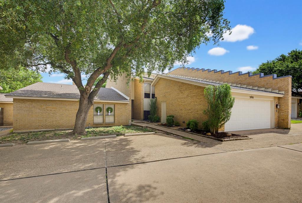 Discover effortless living in this beautifully maintained lock-and-go townhome ideally situated in the heart of Fort Worth near TCU, upscale dining, shopping, and Chisholm Trail Parkway. An impressive two-story vaulted ceiling, expansive windows, updated lighting, and a cozy fireplace highlight the open-concept living space, creating a bright and welcoming atmosphere. The home features two generously sized bedrooms, each with access to a private patio, including a spacious primary suite with dual closets and an ensuite bath with dual vanities. Three private outdoor spaces provide the perfect setting for morning coffee or evening relaxation, while HOA-maintained grounds and resort-style amenities including a pool, clubhouse, and tennis courts offer unmatched convenience and leisure. This exceptional townhome combines comfort, style, and low-maintenance living in one desirable package. Electrical panel replaced in 2023 along with adding whole home surge protection. Carpet replaced June 2026.