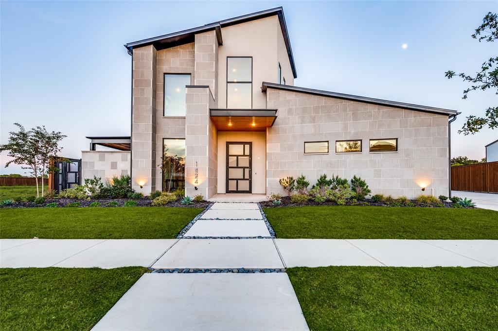 This two-story post-modern industrial home offers breathtaking views of Lake Veridian where white egrets, blue herons, ducks and geese feed each morning. The home's rugged, minimalist architecture complements its natural surroundings with expansive windows and open spaces designed to highlight the stunning scenery. Nearly every room offers panoramic views of the lake and the lush woodland that buffers it from the Trinity River—a landscape that evolves with each season. At sunrise, mist rises off the lake, creating a serene, almost ethereal scene. This home serves as a sanctuary where modern design and nature come together, offering a peaceful retreat from everyday life.

Crafted with top-tier materials & meticulous craftsmanship, the home seamlessly blends modern design with functional elegance. Built with steel beams for durability, the structure offers a sleek, open floor plan. A standing seam metal roof enhances the home’s aesthetic, while striking metal doors—including a pivot-hinged front door—add drama to the entrance. Inside, a grand foyer greets you with a floating staircase & a panoramic glass elevator.

The chef’s kitchen is a standout featuring ample storage without obstructing views, and a massive granite island perfect for entertaining. The kitchen opens to a spacious living area that extends to a large, covered patio with a fireplace, ideal for year-round outdoor enjoyment. The primary suite is a true retreat with a luxurious ensuite bath featuring a freestanding soaking tub, stunning porcelain tiled shower, a dressing table and a custom closet.

Additional highlights include an exercise room with refreshment center, two private offices for flexible work-from-home options, and a media room for the ultimate entertainment experience. The climate-controlled garage is brightly lit and features a convenient pet shower.

Be sure to check out the multiple resort-style pools, tennis & pickleball courts & Viridian Lake with sailing & beach activities.